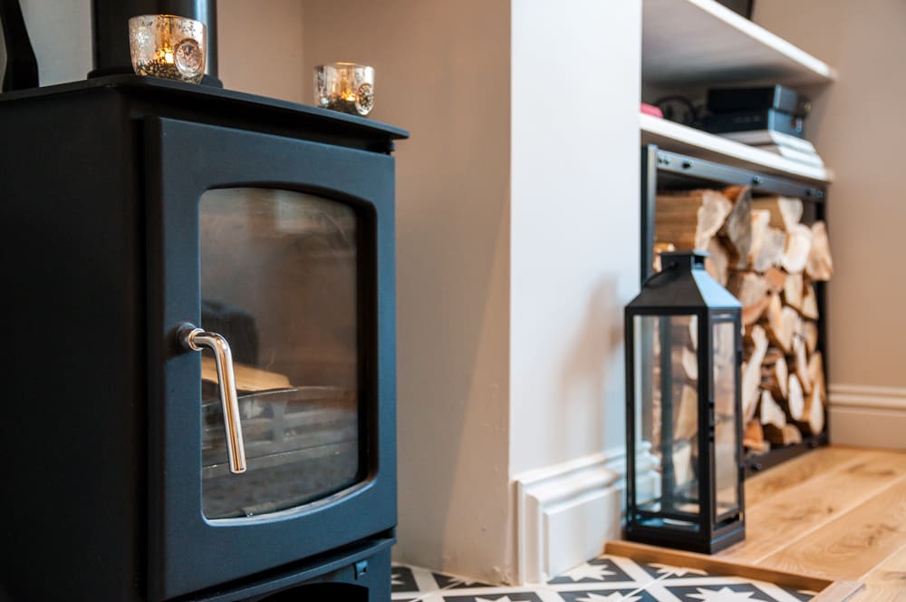 Wood-burning stove in the living room at Maybrick Road, Bath